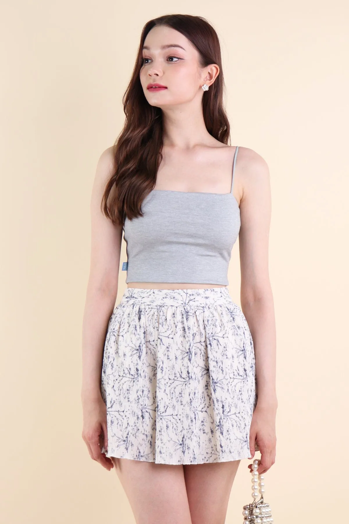 FREESIA FLORAL PLEATED SKORTS IN PORCELAIN